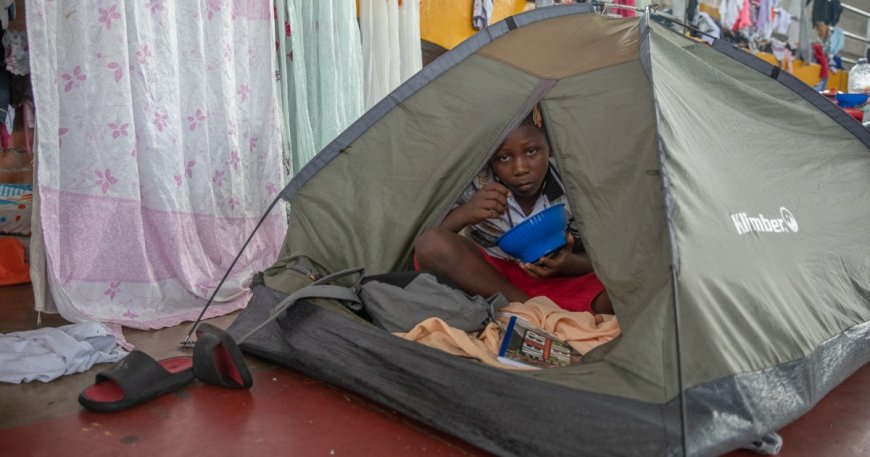 Forced from home, these Colombians struggle to live in a basketball stadium