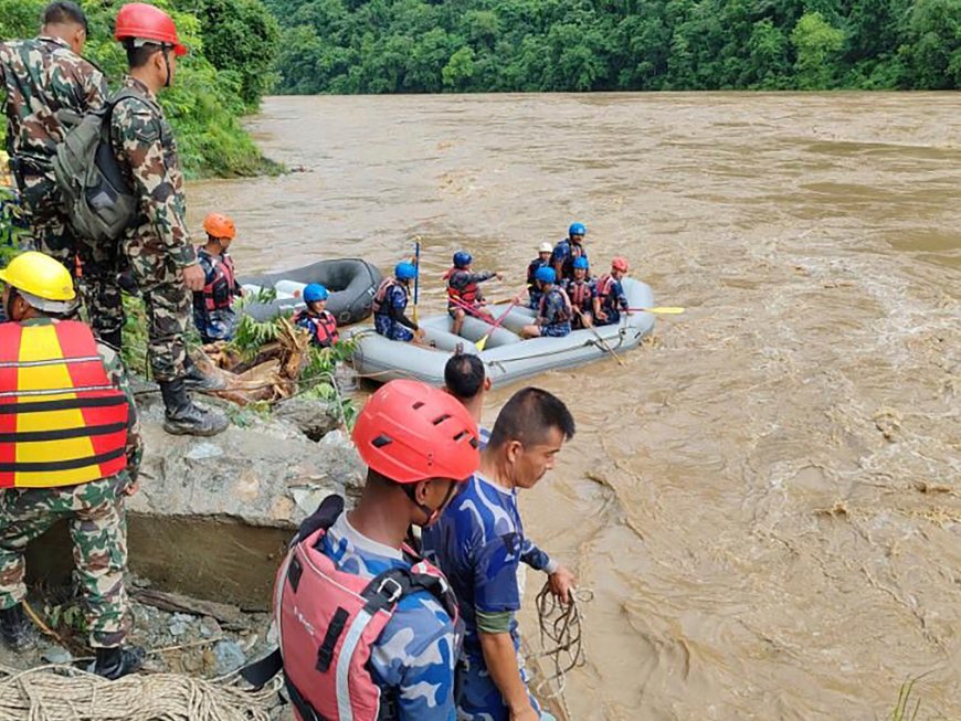 More than 60 people missing after two buses swept into river in Nepal