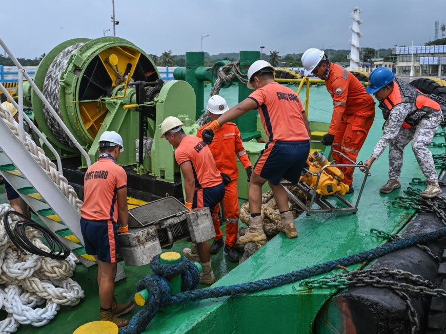 Philippines coastguard says oil leaking from capsized tanker