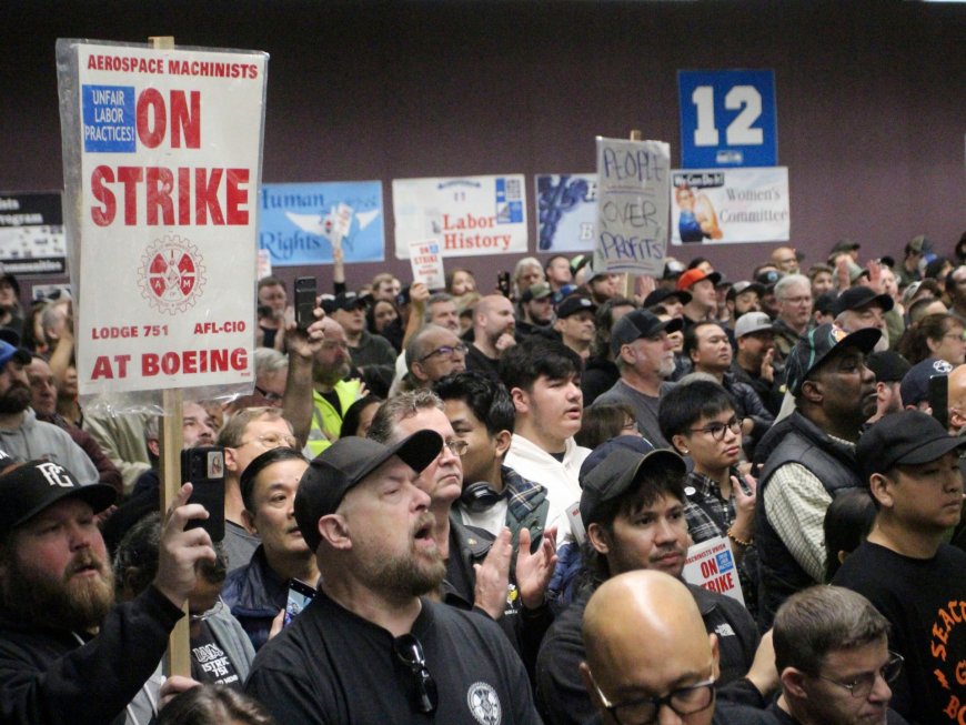 Boeing shores up finances even as striking workers rally