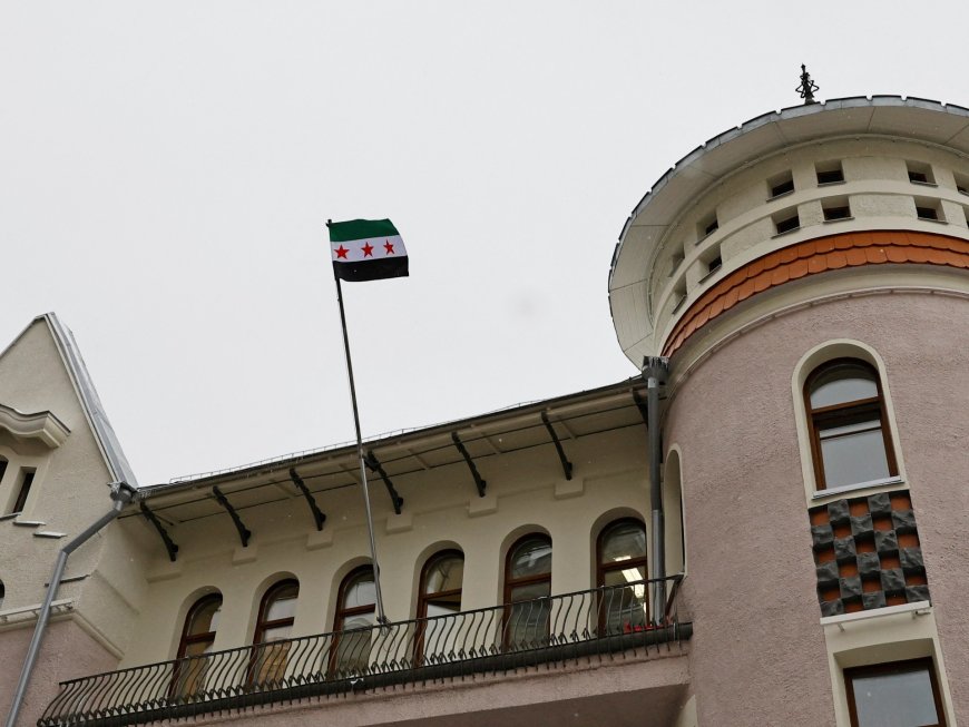 Images of Syria’s opposition flag raised at the embassy in Russia