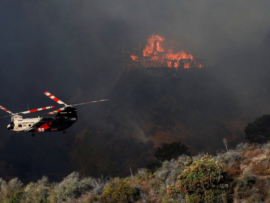 Firefighters race to contain LA wildfires as winds expected to pick up